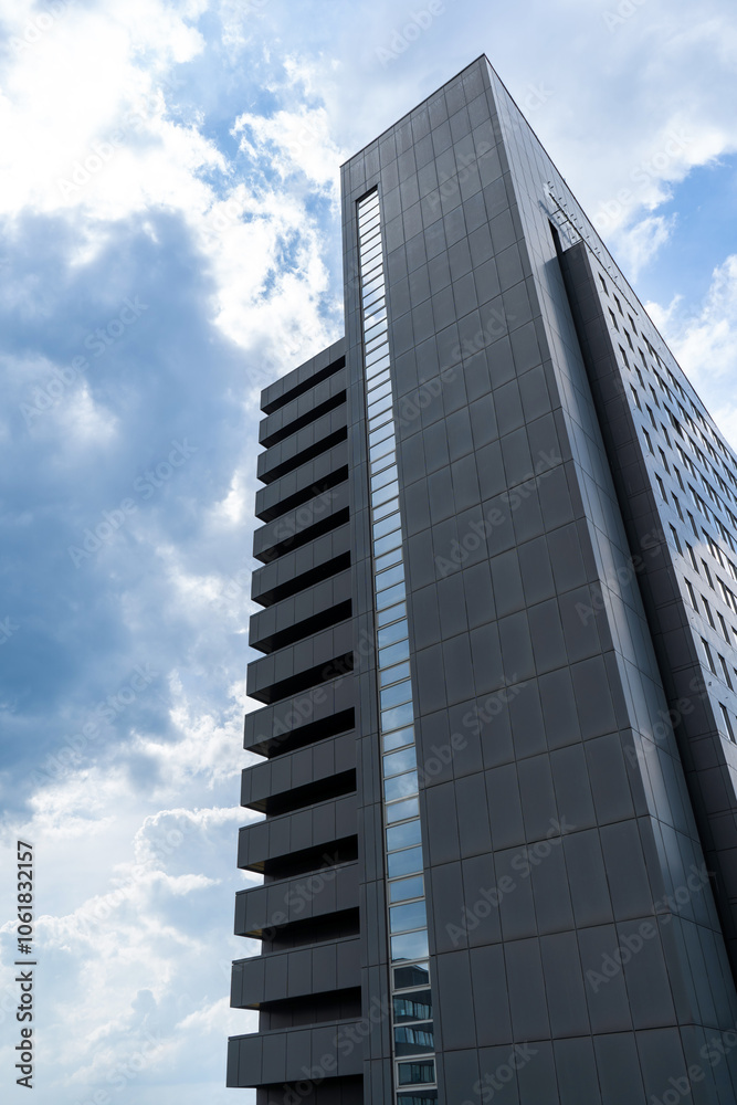 Tall skyscraper in Prague, cloudy sky on background Tall skyscraper in Prague, cloudy sky on background