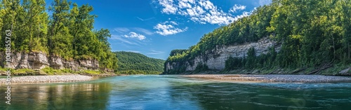 A stunning view of Buffalo National River showcasing lush greenery and tranquil waters on a sunny day