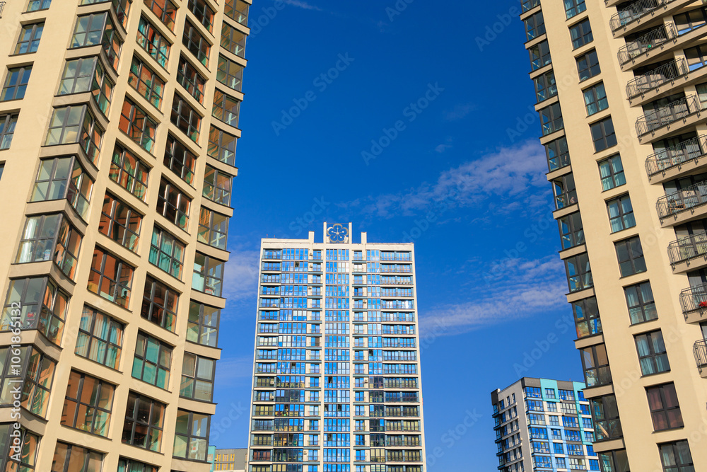 City view, modern buildings and skyscrapers against the blue sky. City view, modern buildings and skyscrapers against the blue sky.