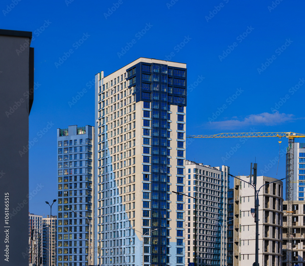 Modern buildings, walls and windows. City view on a sunny day. Modern buildings, walls and windows. City view on a sunny day.