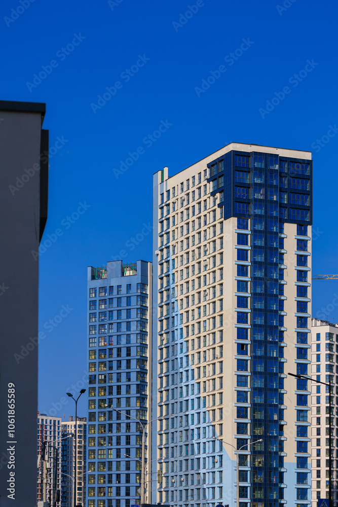 City view, modern buildings and skyscrapers against the blue sky. City view, modern buildings and skyscrapers against the blue sky.