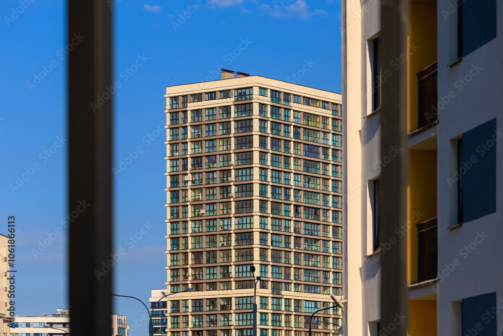 Φωτογραφία City view, modern buildings and skyscrapers against the blue sky.