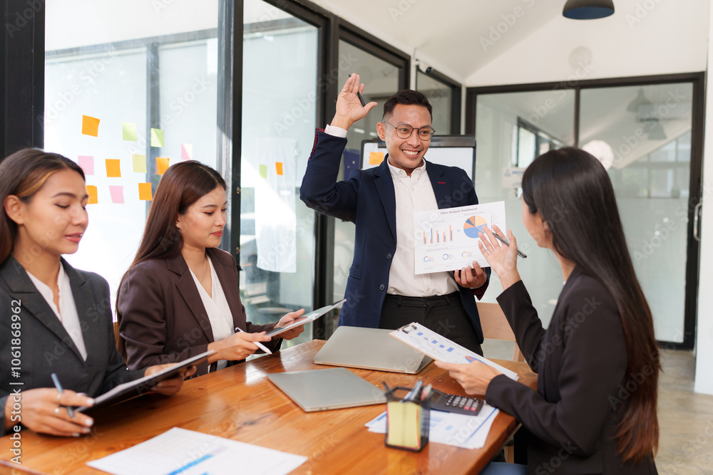 A group of Asian businessmen is Meeting to discuss presentations exchange knowledge Presentation about office work A group of Asian businessmen is Meeting to discuss presentations exchange knowledge Presentation about office work