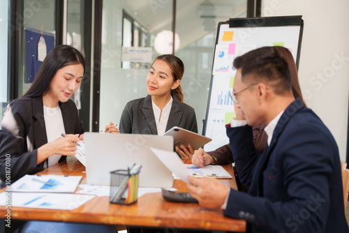 Group of Asian businessmen Sitting in meetings, talking, exchanging knowledge, presenting work.