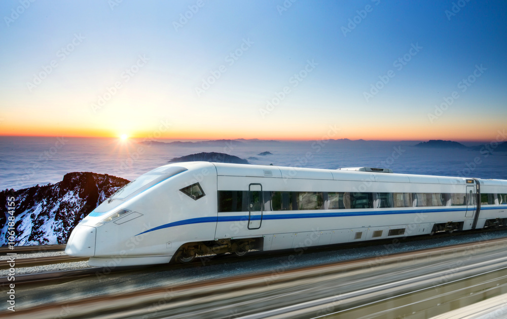The high-speed train passes through the snow capped mountains