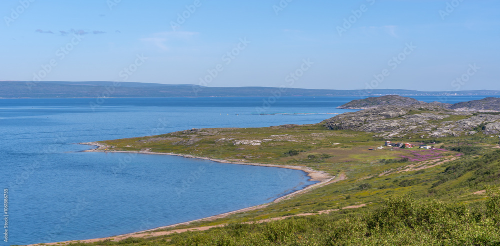 The desert stony shore of the small gulf of Barents sea. Short polar summer in Finnmark, Norway The desert stony shore of the small gulf of Barents sea. Short polar summer in Finnmark, Norway