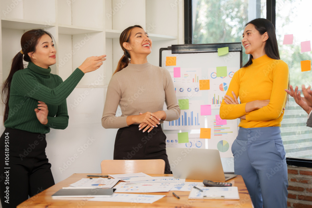 Asian Business Group Chat about graph work Present in meetings, in the office Asian Business Group Chat about graph work Present in meetings, in the office