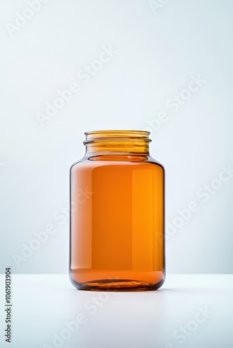 Amber glass bottle filled with orange liquid