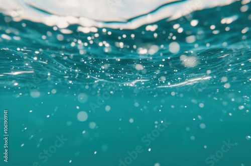 Underwater view of sparkling blue water with bubbles