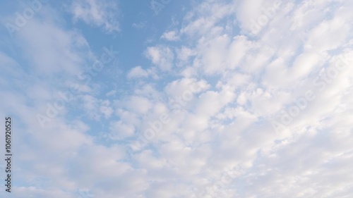 Fluffy white clouds against a vibrant blue sky, creating a peaceful and serene atmosphere, natural, white