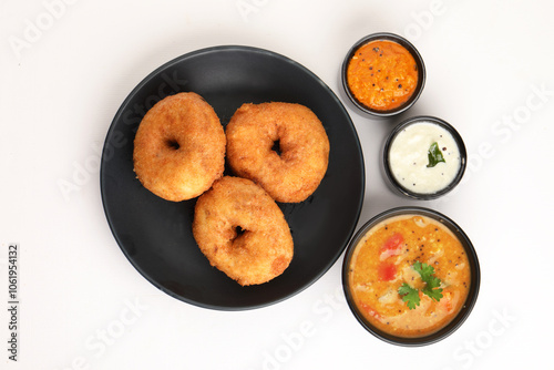 Traditional breakfast of South India IDLY VADA served with sambar Chutney in a ceramic plate photo