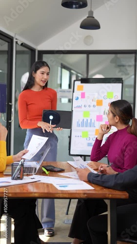 Modern Office Collaboration Womans Presentation on Data and Teamwork with Charts and Documents in Productive Meeting