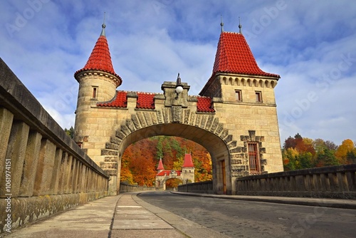 Beautiful old dam Les Kralovstvi - Czech Republic. Autumn background with colorful trees. Nature with landscape. Seasonal concept for fall.