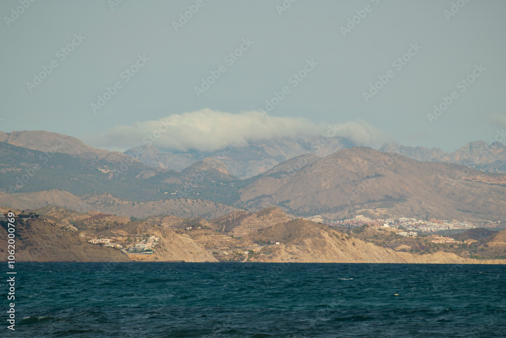 Coastal Mountain Landscape with Cloud-Covered Peaks Coastal Mountain Landscape with Cloud-Covered Peaks