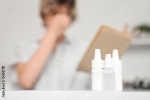 Young woman with bad sight ...