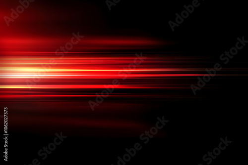 The effect of red light in fast motion on a black background. blurred abstract background with long exposure. neon light