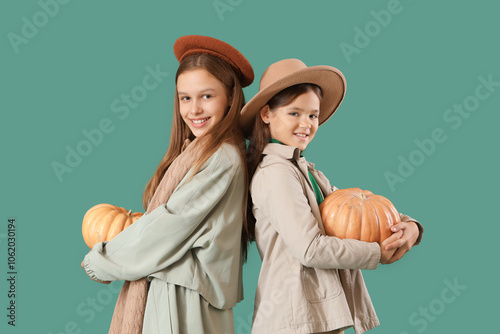 Cute girls in autumn clothe...