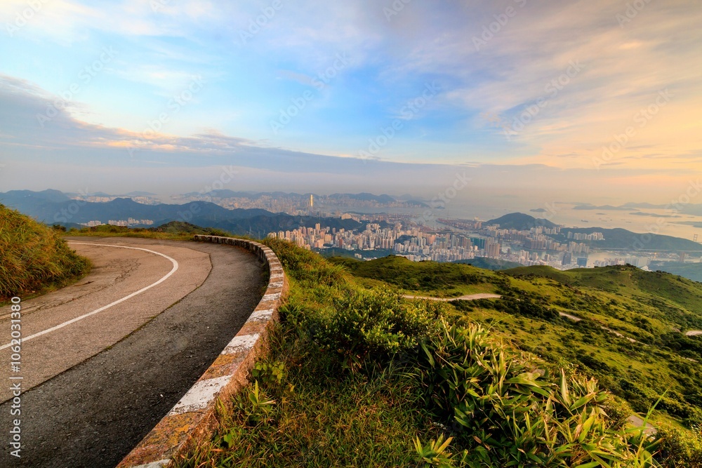 Scenic Mountain Road Overlooking a Bustling Cityscape at Sunset, Tai Mo Shan, Hong Kong