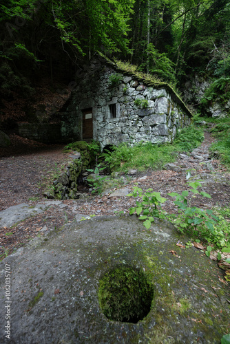 Water wheel mill (Moulin de Chambeuil), Laveissiere, Cantal, Auvergne-Rhone-Alpes, France photo