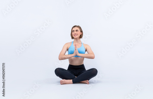 Full body length gaiety shot athletic and sporty woman doing healthy and meditative yoga exercise workout posture on isolated background. Healthy active and body care lifestyle