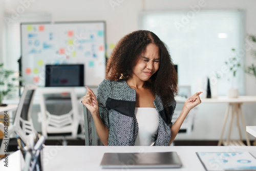 Manager sitting at desk and pinching her nose because of bad smell, expressing disgust