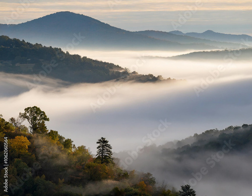 Misty firefly fog enveloping the mountains at dawn, creating a serene landscape. Generative AI
