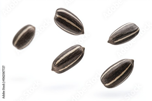 Wallpaper Mural Multiple striped sunflower seeds suspended and isolated against a white background. Ideal for themes related to healthy snacks, nutrition, and natural foods. Torontodigital.ca