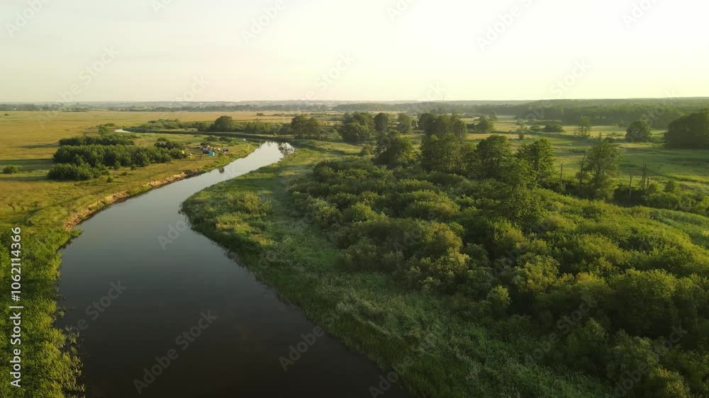 Aerial drone view of the river and green forests, landscape on a summer day Aerial drone view of the river and green forests, landscape on a summer day