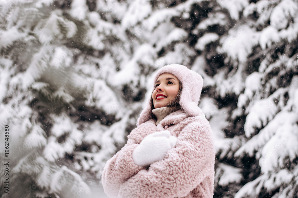 Portrait of a happy young attractive woman in a light hat and fur coat in a winter forest. Winter concept. Portrait of a happy young attractive woman in a light hat and fur coat in a winter forest. Winter concept.