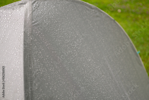 Konstfotografi Raindrops on the gray tent surface after the summer rainfall.
