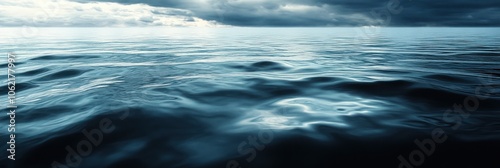 Stormy sea with dark clouds and rippling waves.