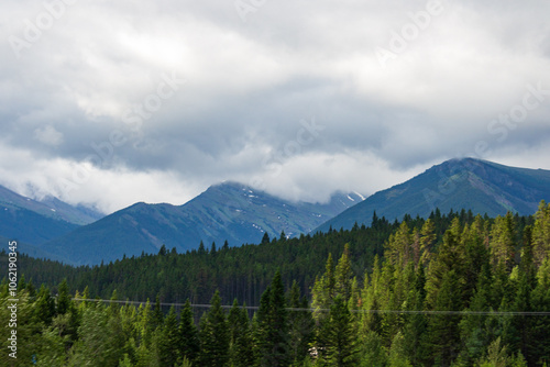 Majestic Mountain Range Under Dramatic Cloudy Sky