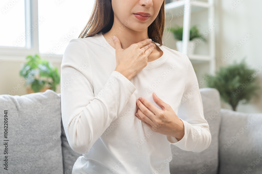 Acid reflux disease, suffer asian young woman have symptom gastroesophageal, esophageal, stomach ache and heartburn pain hand on chest from digestion problem after eat food, Healthcare medical concept Acid reflux disease, suffer asian young woman have symptom gastroesophageal, esophageal, stomach ache and heartburn pain hand on chest from digestion problem after eat food, Healthcare medical concept