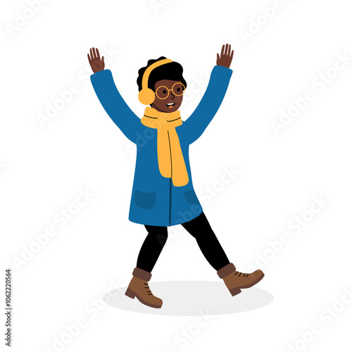 Joyful child dancing in winter attire with earmuffs and a scarf on a snowy day