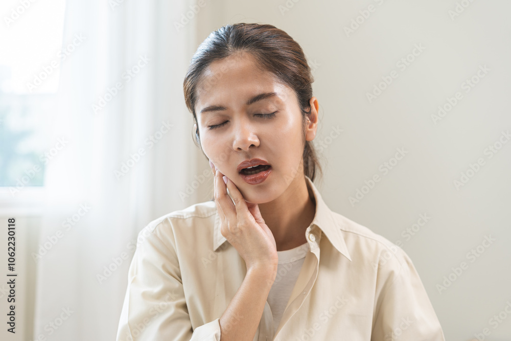 Jaw pain, health care concept. Teeth pain and dentistry asian young woman, girl suffering touching her cheek. Female feeling painful toothache. Unhappy feel bad, diseases in oral, ache nerve and molar Jaw pain, health care concept. Teeth pain and dentistry asian young woman, girl suffering touching her cheek. Female feeling painful toothache. Unhappy feel bad, diseases in oral, ache nerve and molar