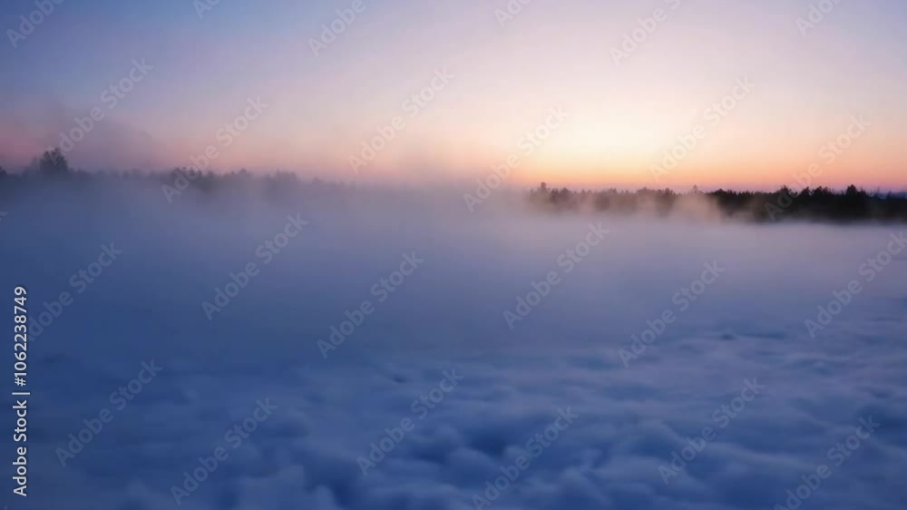 Capture the ethereal beauty of mist rising over a snowy landscape at dawn. Capture the ethereal beauty of mist rising over a snowy landscape at dawn.