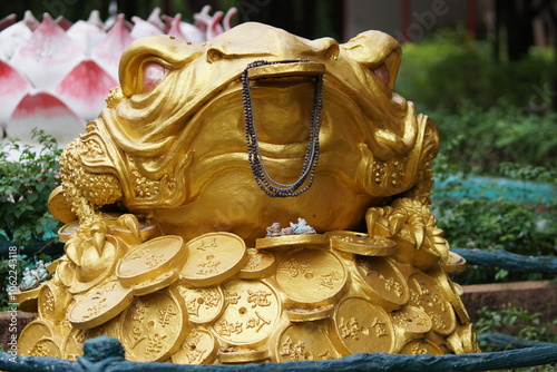 golden statue in temple, rich statue, golden frog of rich statue photo