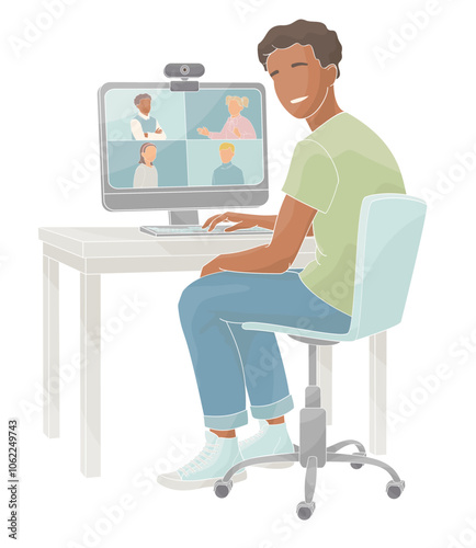 African American boy sits in a chair at a table working on a computer videoconferencing