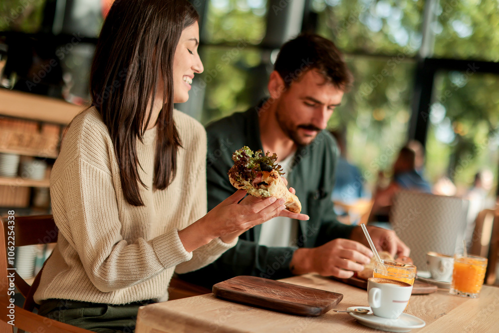 Enjoying a delightful brunch together at a cozy cafe on a sunny afternoon in the heart of the city Enjoying a delightful brunch together at a cozy cafe on a sunny afternoon in the heart of the city