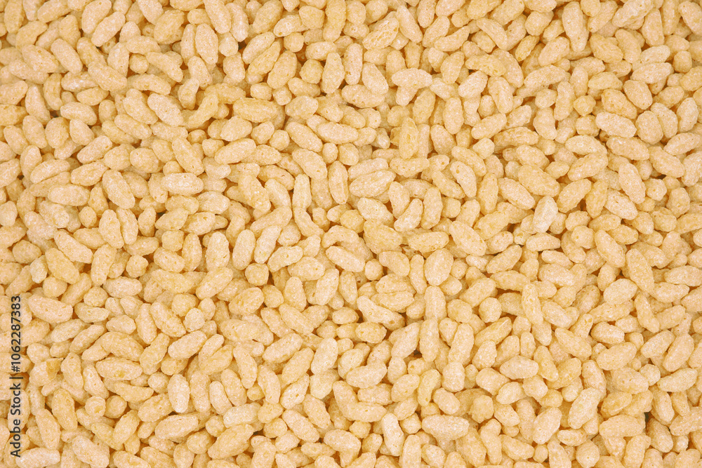 Close-up of puffed rice cereal background, ideal for breakfast, snack, and food texture concepts. Close-up of puffed rice cereal background, ideal for breakfast, snack, and food texture concepts.