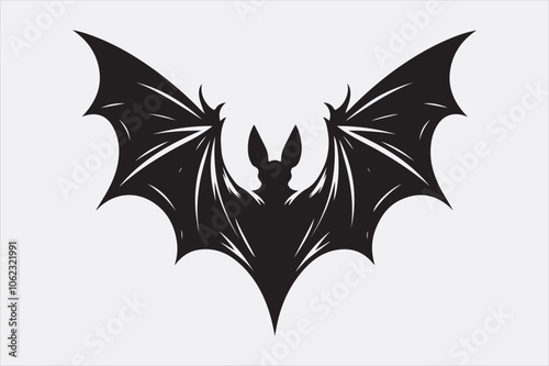 A black silhouette of a flying bat with outstretched wings.