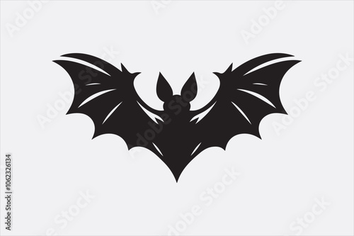 A black silhouette of a flying bat with outstretched wings.