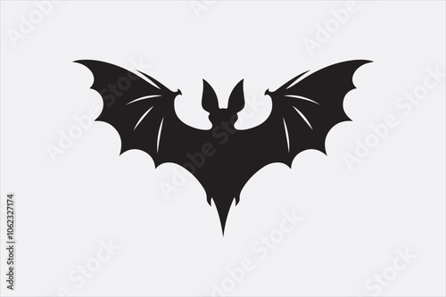 A black silhouette of a flying bat with outstretched wings.