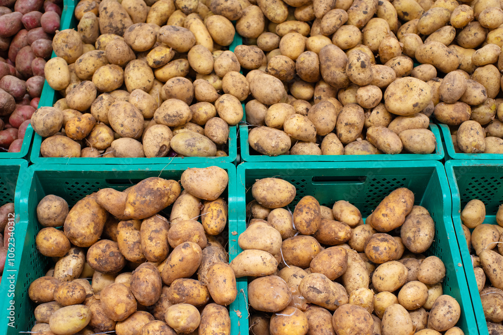 Baskets with different varieties of potatoes in boxes on the shelf of the supermarket, vegetable market. Baskets with different varieties of potatoes in boxes on the shelf of the supermarket, vegetable market.