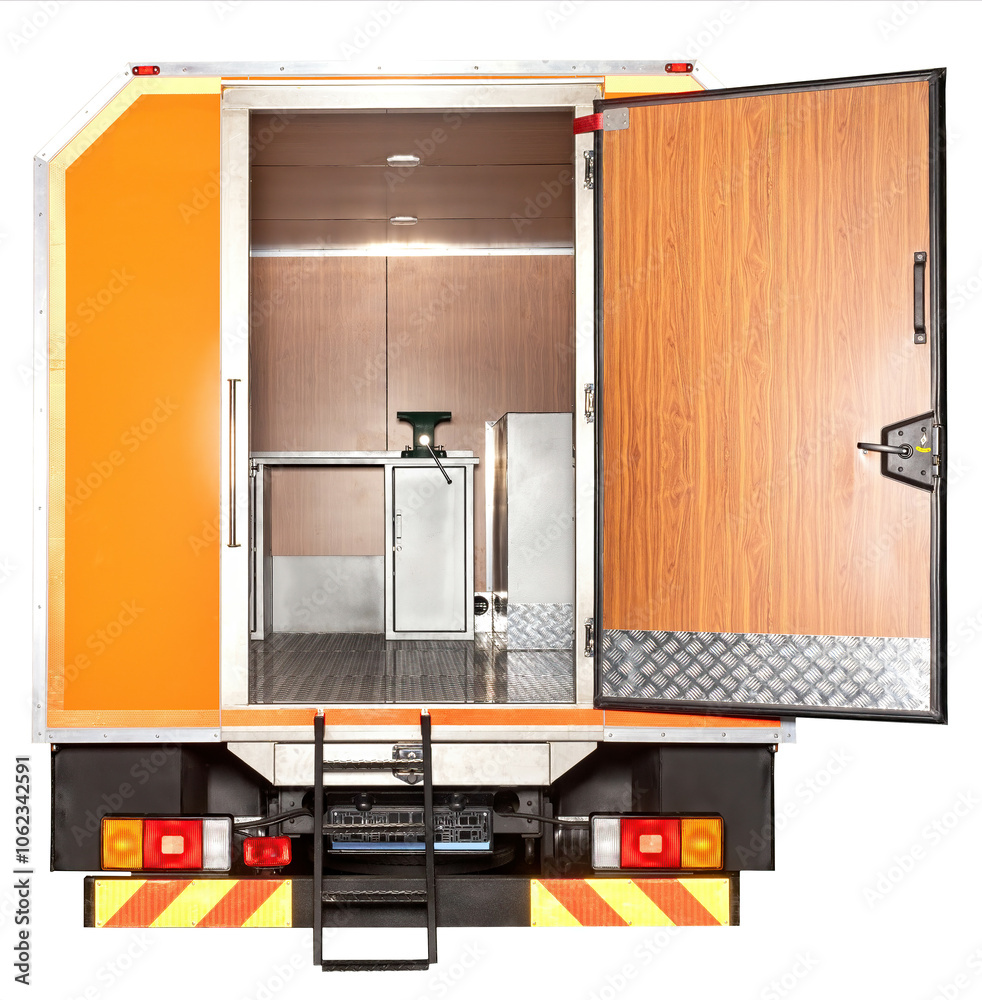 Interior view of mobile food truck with open rear door, showcasing kitchen equipment and stainless steel surfaces, culinary workspace concept