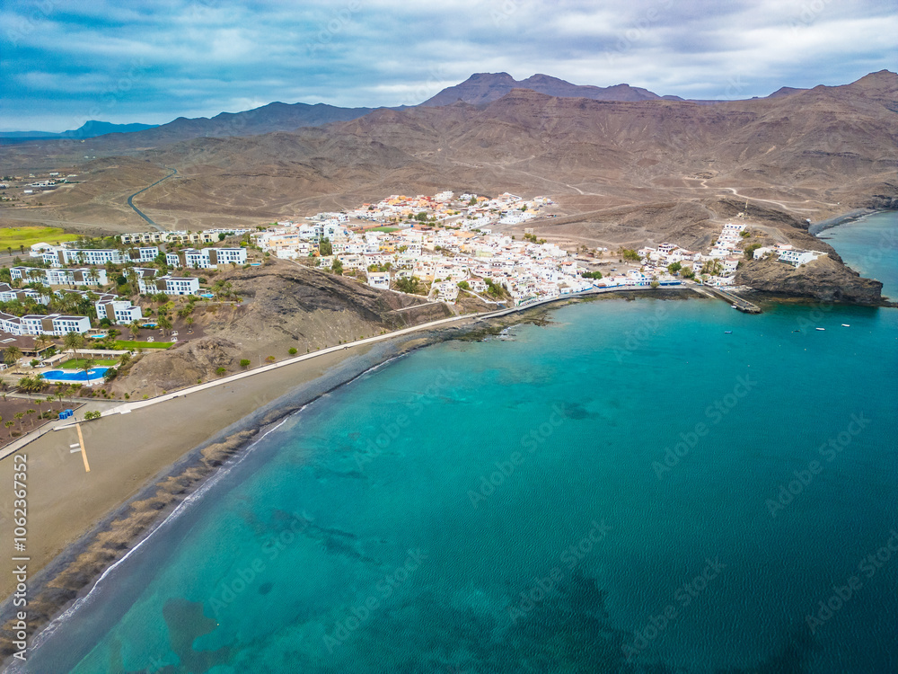 Naklejka premium Aerial drone view of Las Playitas fishing town and the beach, Fuerteventura, Canary Islands