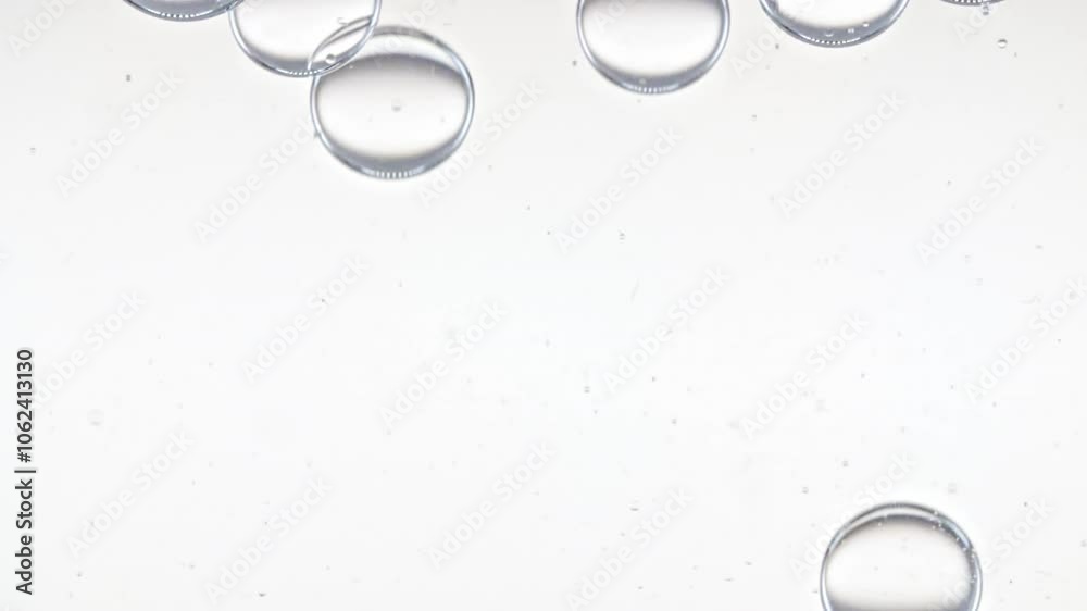 Clear Bubbles Form and Float to Another Ones on Transparent Surface on White Background. The Medicine Concept, Health Care, Body Care Cosmetics. Macro Shot. Slow Motion. High quality FullHD footage Clear Bubbles Form and Float to Another Ones on Transparent Surface on White Background. The Medicine Concept, Health Care, Body Care Cosmetics. Macro Shot. Slow Motion. High quality FullHD footage