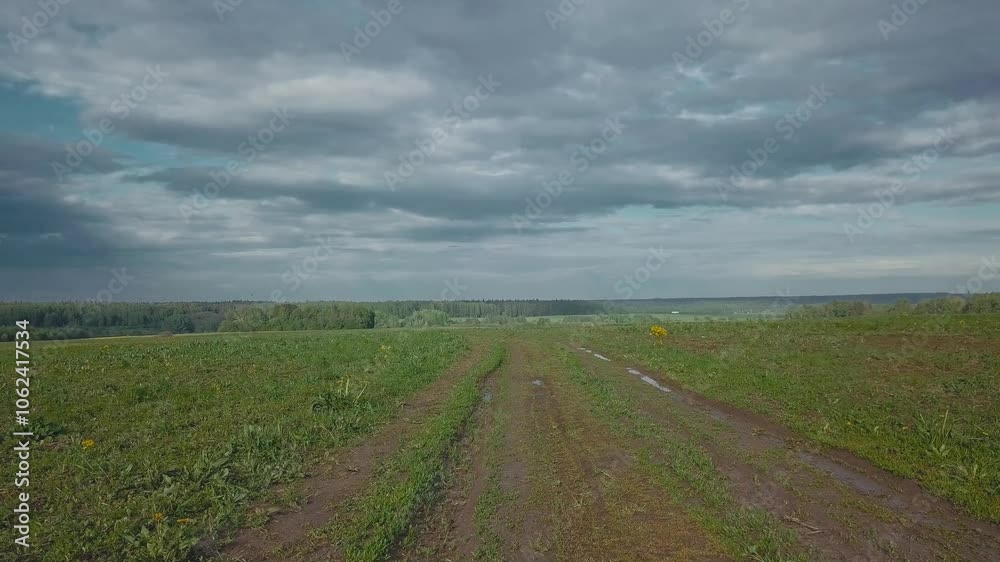 A beautiful cinematic frame of nature. A picture of a small river among fields A beautiful cinematic frame of nature. A picture of a small river among fields