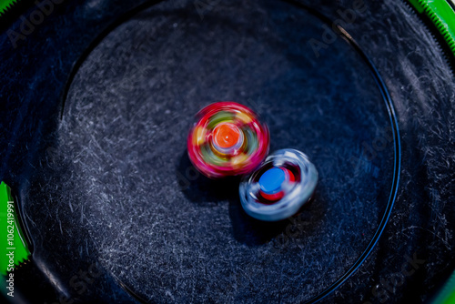 Beyblade battle of spinning toys in a fight of a Japanese origin game photo