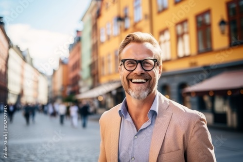 Portrait of a smiling senior man with eyeglasses in the city